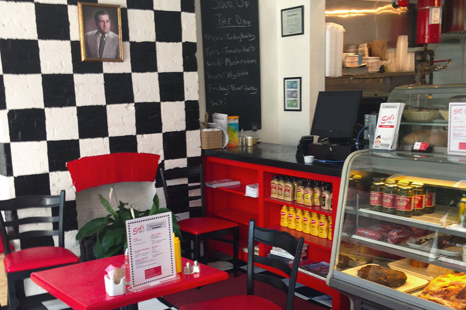 The interior of the restaurant, with black and white checkers and red counters