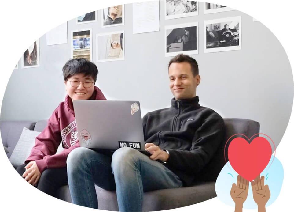 2 people working on a laptop together